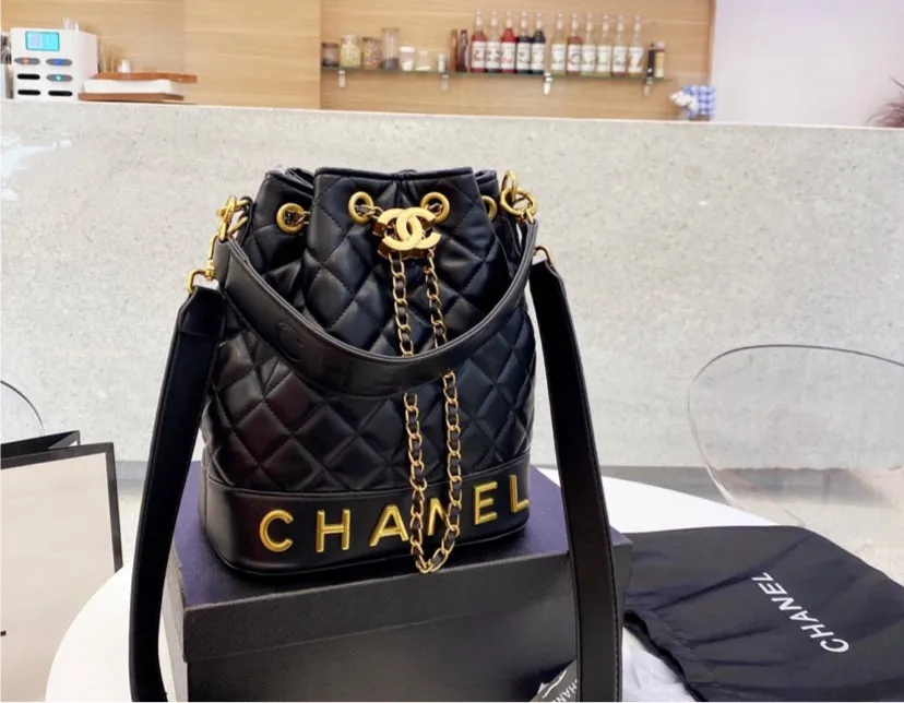 Black Chanel woman handbag