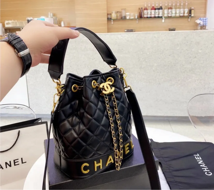 Black Chanel woman handbag